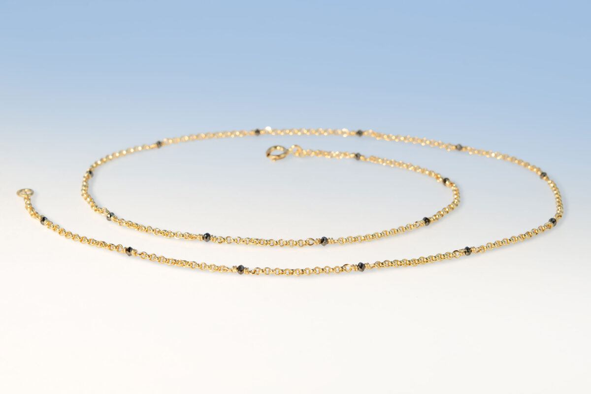 Kette gelbgold 18 diam schwarz