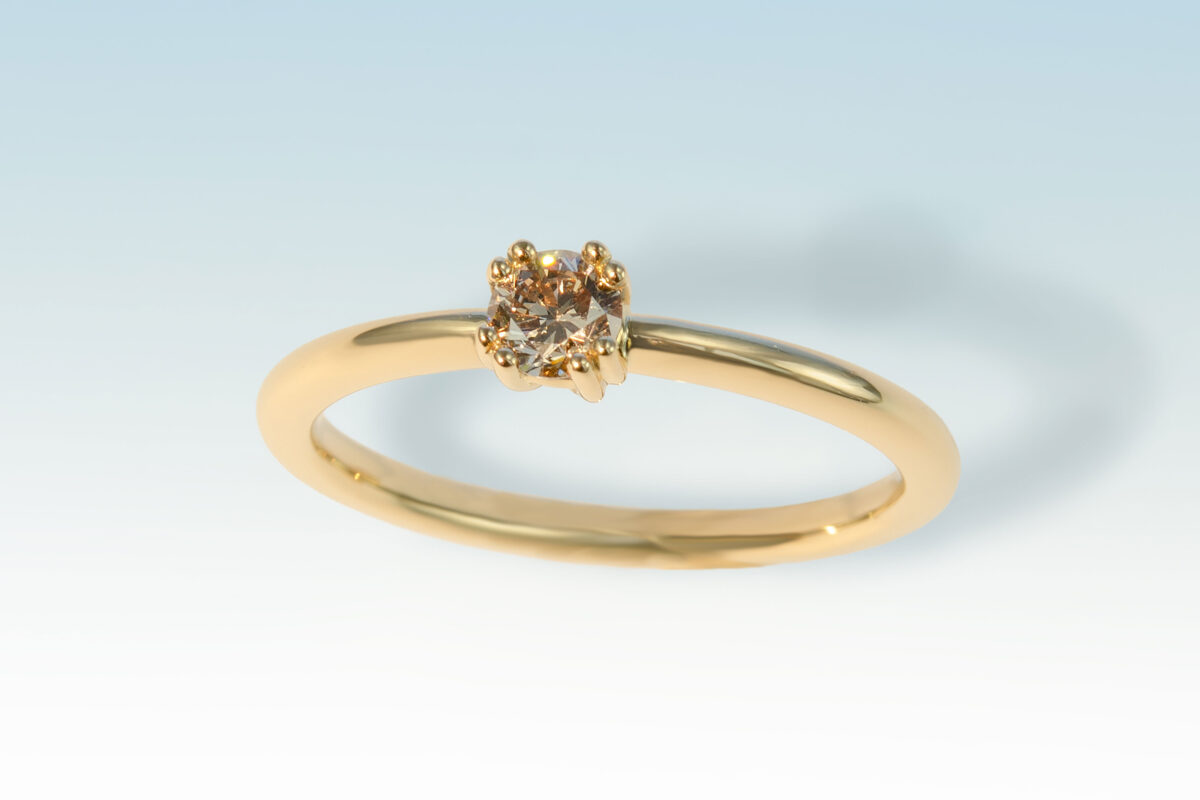 Ring solitaer gg 4 griff diam braun